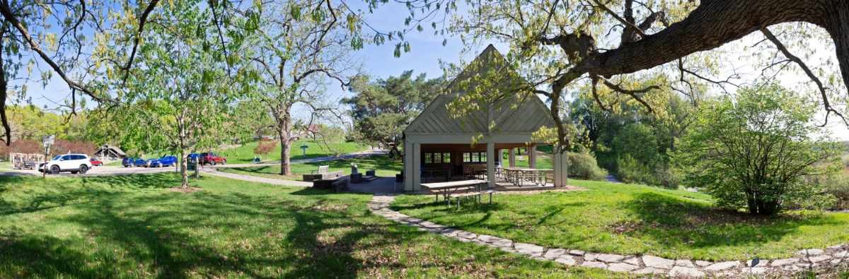 Ordway picnic shelter with trees and parking lot