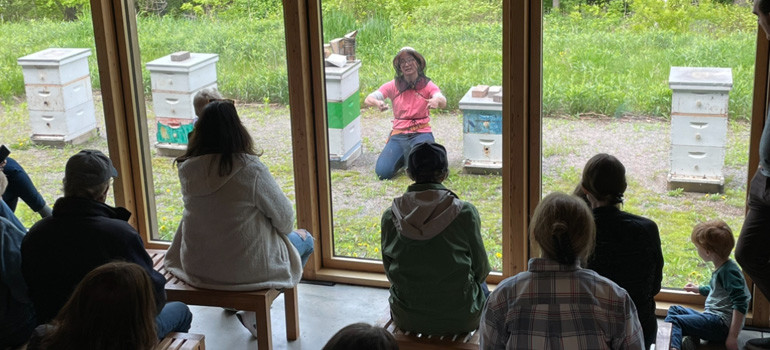 Watching the beekeeper at the Bee Center, photo by Jill Leenay.