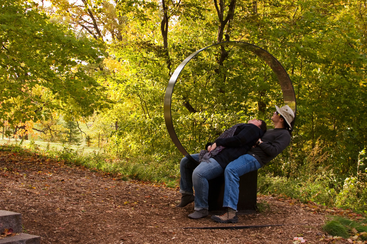 People laying in the circle sculpture