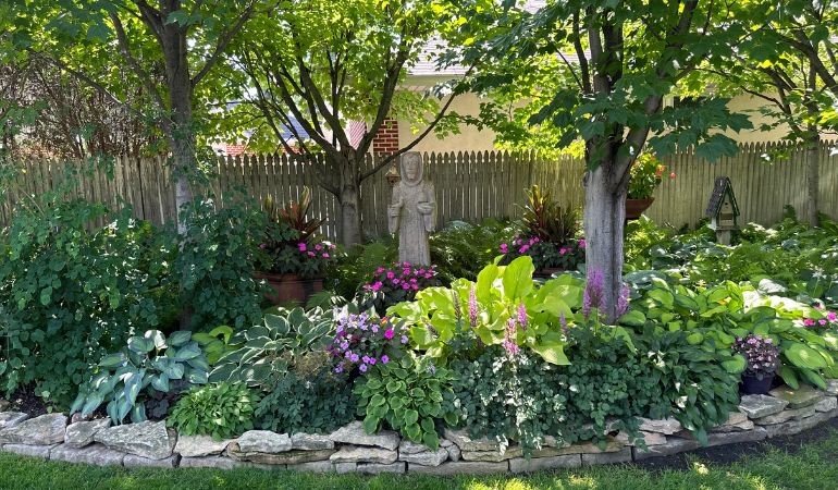 Private garden with hostas and statues