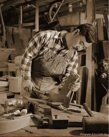 George Nakashima working on a wood table